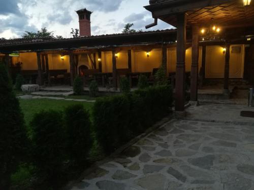 a house with a patio at night with lights at Once upon a time in Koprivshtitsa