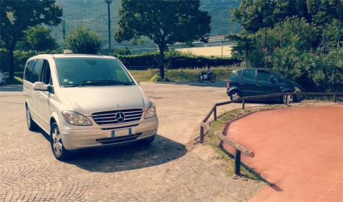 a white van parked in a parking lot at Cà della Roggia in Rovereto