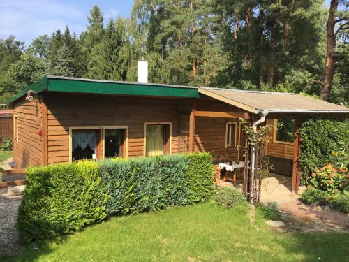 Сад в Holzhaus Trollblümchen am Wald und See