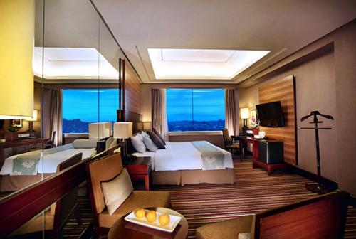 Cama ou camas em um quarto em Aston Samarinda Hotel and Convention Center