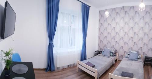 Un televizor și/sau centru de divertisment la Guest Room RÓWNA