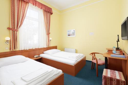 Postel nebo postele na pokoji v ubytování Hotel Nikolas