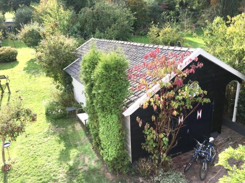 Un jardín fuera de Natuurhuisje Heerlijkheid Beek