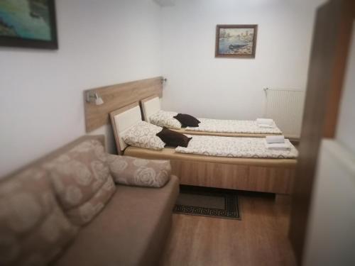 Ліжко або ліжка в номері Rooms Aračić