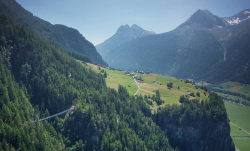 a view of a valley with trees and mountains at Apart Andrea in Längenfeld