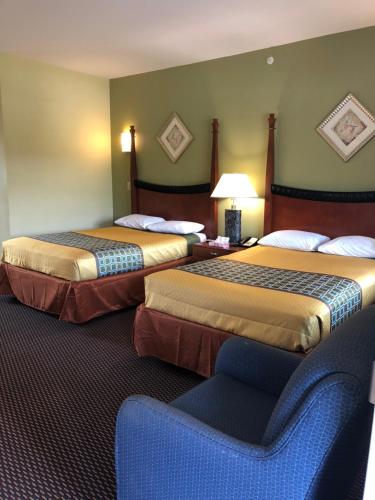 Кровать или кровати в номере Budget Inn Williamsport