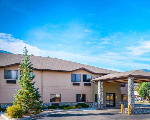 a building with a christmas tree in front of it at Comfort Inn Salida in Salida