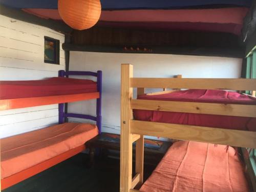 Cama ou camas em um quarto em La Cañada Cabo Polonio