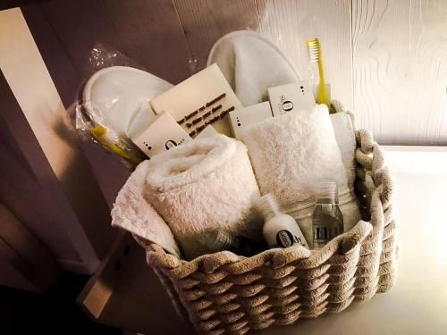 a basket filled with towels and other items at Papere e Tulipani in Vicenza