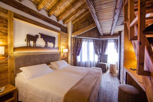 Letto o letti in una camera di Hotel Pilier D'Angle & Wellness