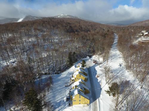 an aerial view of a ski lodge in the snow at Luxurious Trailside Village One Bedroom Condo #1 in Killington