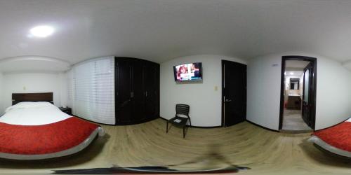 Televisyen dan/atau pusat hiburan di Hotel Florida ApartaSuites.