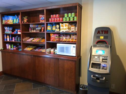 a food vending machine next to a counter with food at Chateau Saint John Trademark Collection by Wyndham in Saint John