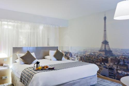 Ліжко або ліжка в номері Mercure Paris Vaugirard Porte De Versailles