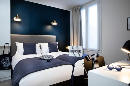 Hotel Brady - Gare de l'Est में एक कमरे में एक या कई बेड