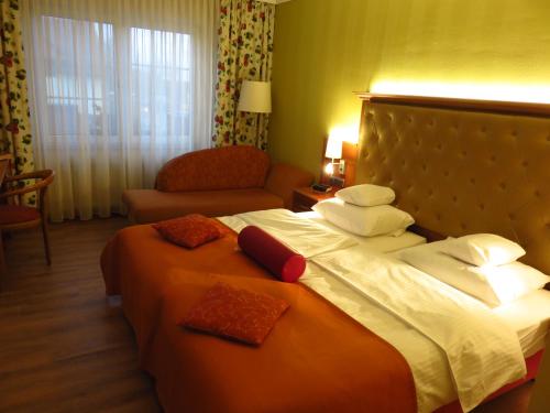 เตียงในห้องที่ Ringhotel Hotel Zum Stein