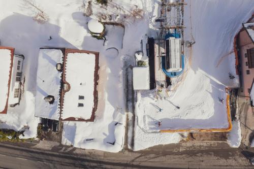 an overhead view of a building with snow on it at Apartment NinetyFour in Annaberg im Lammertal