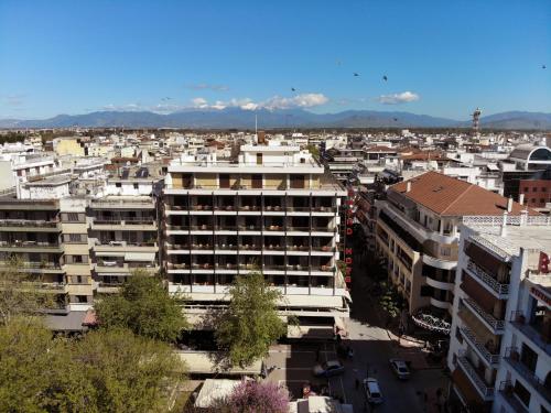 an aerial view of a city with buildings at Grand Hotel in Larisa