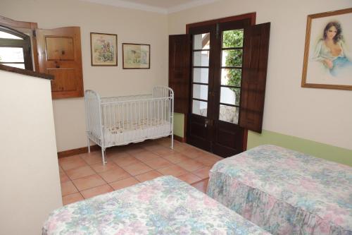 Una cama o camas en una habitación de Quinta de Rio Alcaide