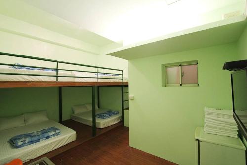 Tempat tidur dalam kamar di Rich House B&B