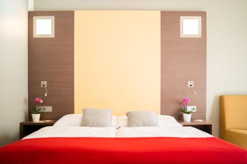 Cama ou camas em um quarto em Hotel Orangerie