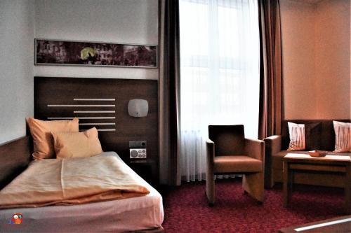 Postel nebo postele na pokoji v ubytování Hotel Brühlerhöhe