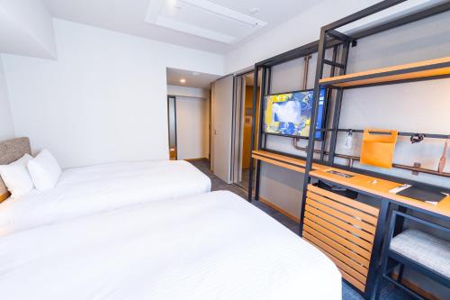 Una cama o camas en una habitación de ICI HOTEL Asakusabashi