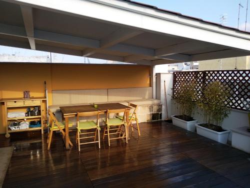 a patio with a table and chairs on a balcony at Dimora Dioniso in Polignano a Mare