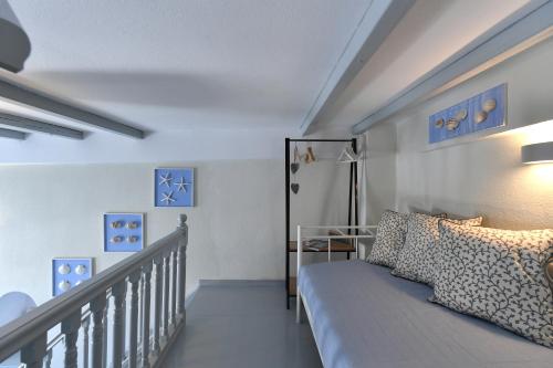 A bed or beds in a room at ALMYRA SeaView Maisonette in Naousa