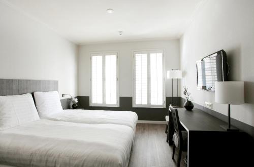 Cama ou camas em um quarto em Fletcher Hotel - Restaurant Nautisch Kwartier