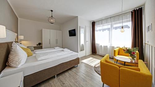 Tempat tidur dalam kamar di Neckarbett - Self Service Hotel