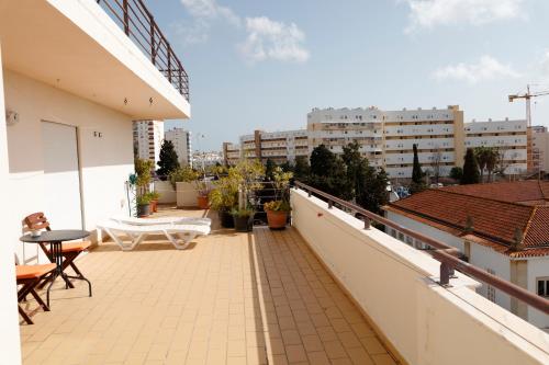 En balkon eller terrasse på BellaVita City Faro