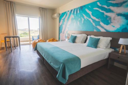 Ένα ή περισσότερα κρεβάτια σε δωμάτιο στο Star inn Peniche