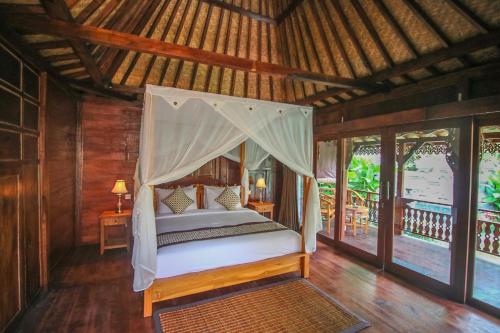 Ari Cottages Ubud房間的床