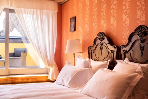 Cama ou camas em um quarto em Relais & Chateaux Villa Crespi