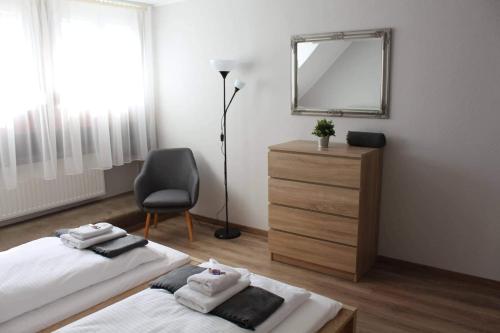 Una cama o camas en una habitación de Strigonia Apartman