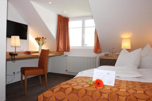 Giường trong phòng chung tại Altstadt-Hotel Passau