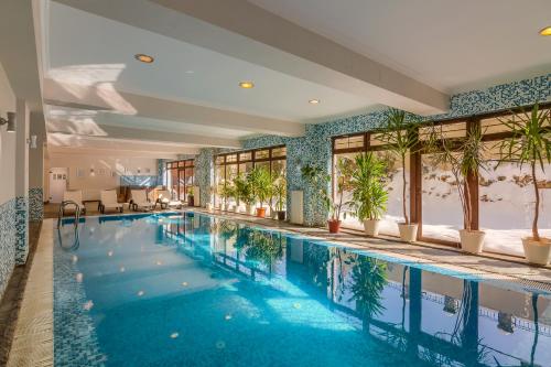 The swimming pool at or close to Rizzo Boutique Hotel