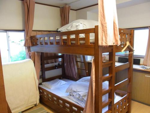 Ліжко або ліжка в номері Guesthouse Tamura