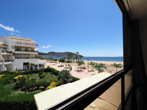 a view of the beach from the balcony of a hotel at InmoSantos Oasis A3 in Roses