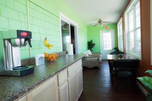 a kitchen with a counter with bananas on it at Eastern Inn in Bourne