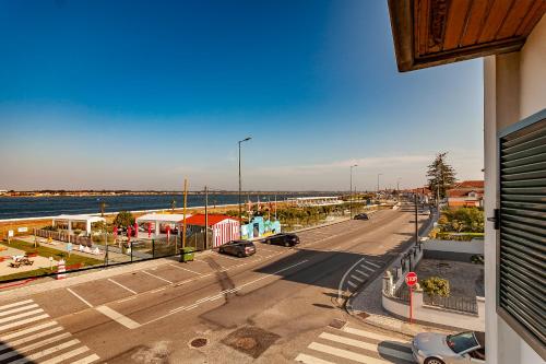 a view of a street with cars on the road at Costa Nova Ria View Apartment by Home Sweet Home Aveiro in Costa Nova