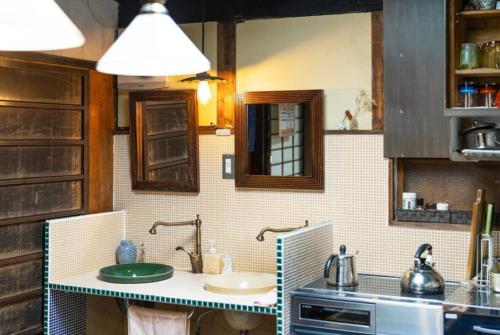 A kitchen or kitchenette at Guest House Koiya