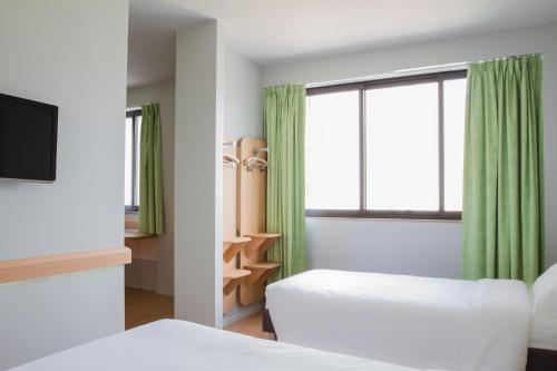 Ibis Budget Braga Centro 객실 침대