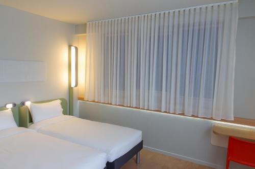 Ibis Budget Braga Centro 객실 침대