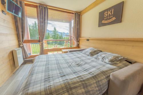 Cama ou camas em um quarto em Grand Arbois, les Arcs 1800