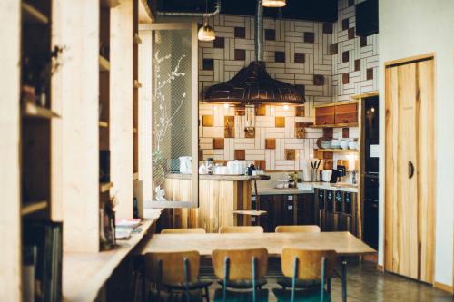 a kitchen with a table and chairs in it at Len Kyoto Kawaramachi in Kyoto