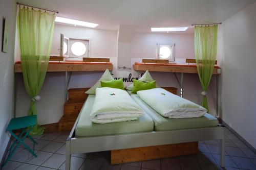 A bed or beds in a room at Bergwerksilo Herznach