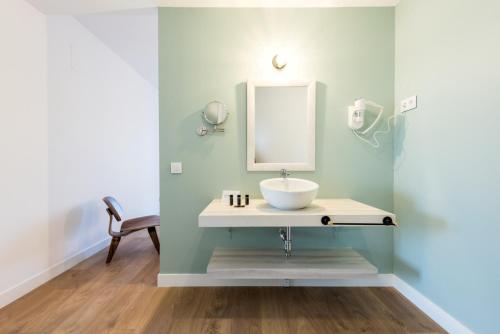 a bathroom with a sink and a mirror at Plaza de España Skyline in Madrid