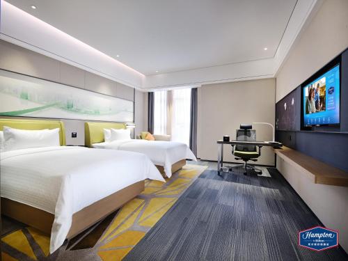 Hampton by Hilton Guangzhou Dongxiaonan tesisinde bir televizyon ve/veya eğlence merkezi